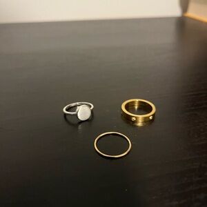 Trio of silver and gold rings